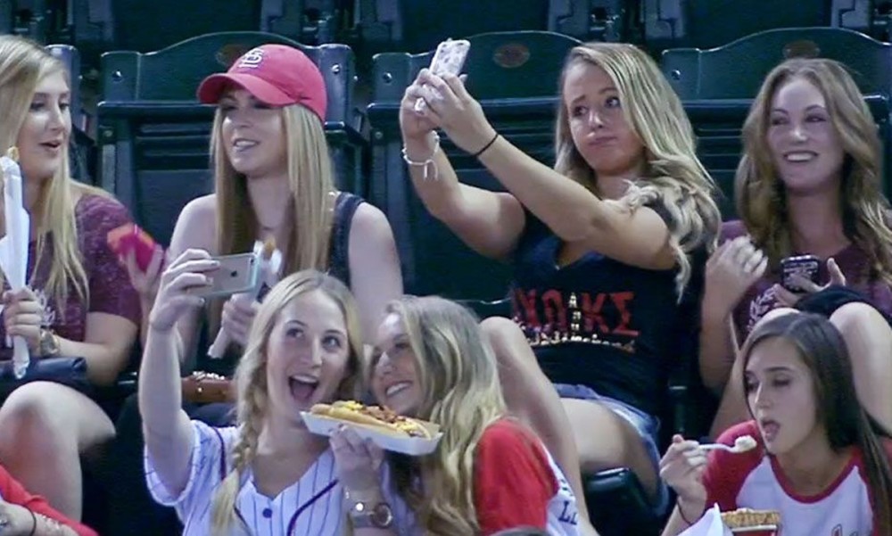 Image result for baseball fans on phones bored