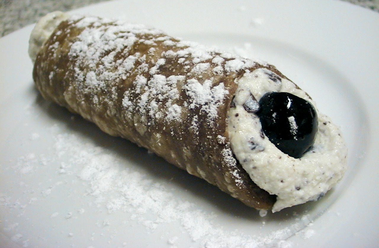 Cannoli With Chocolate Shavings and Black Cherries.