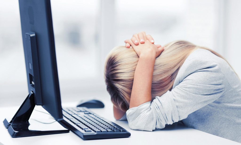 Stressed Woman at Computer