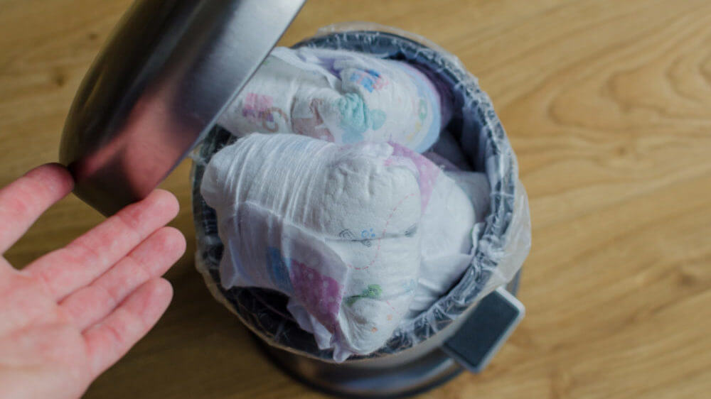 Trash can full of used diapers