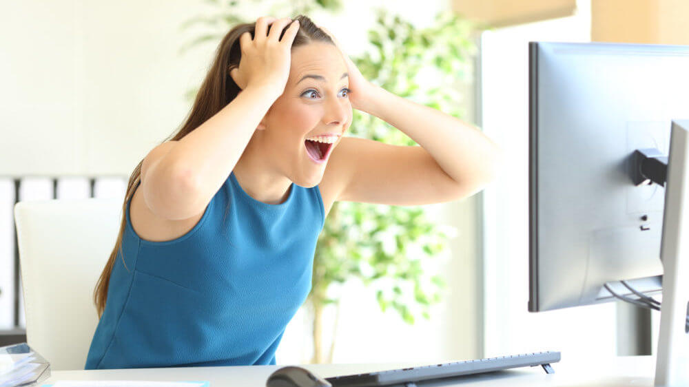 Woman Excited at Computer