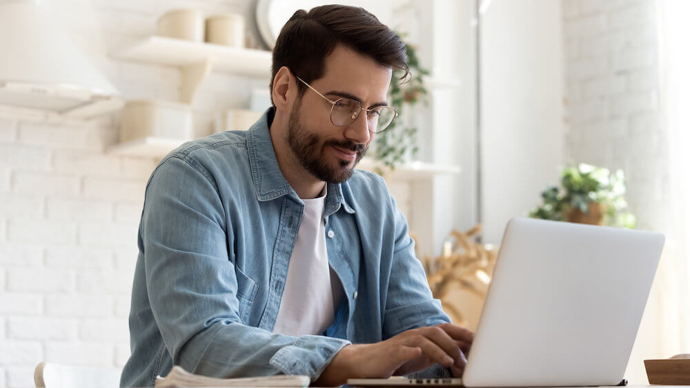 Man typing on computer