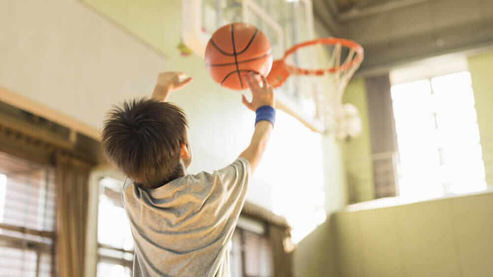 Kid playing basketball