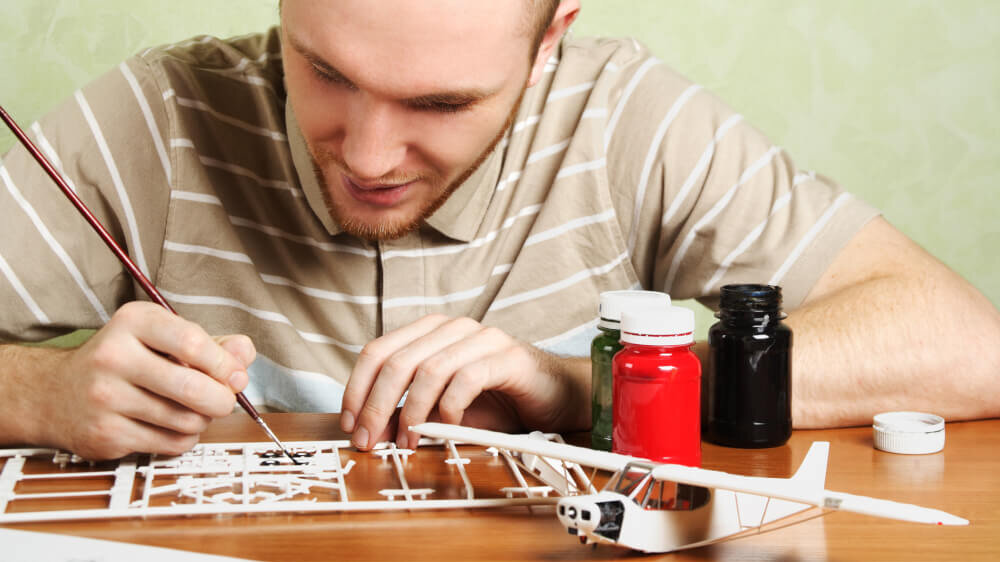 Man Working on Model Airplane